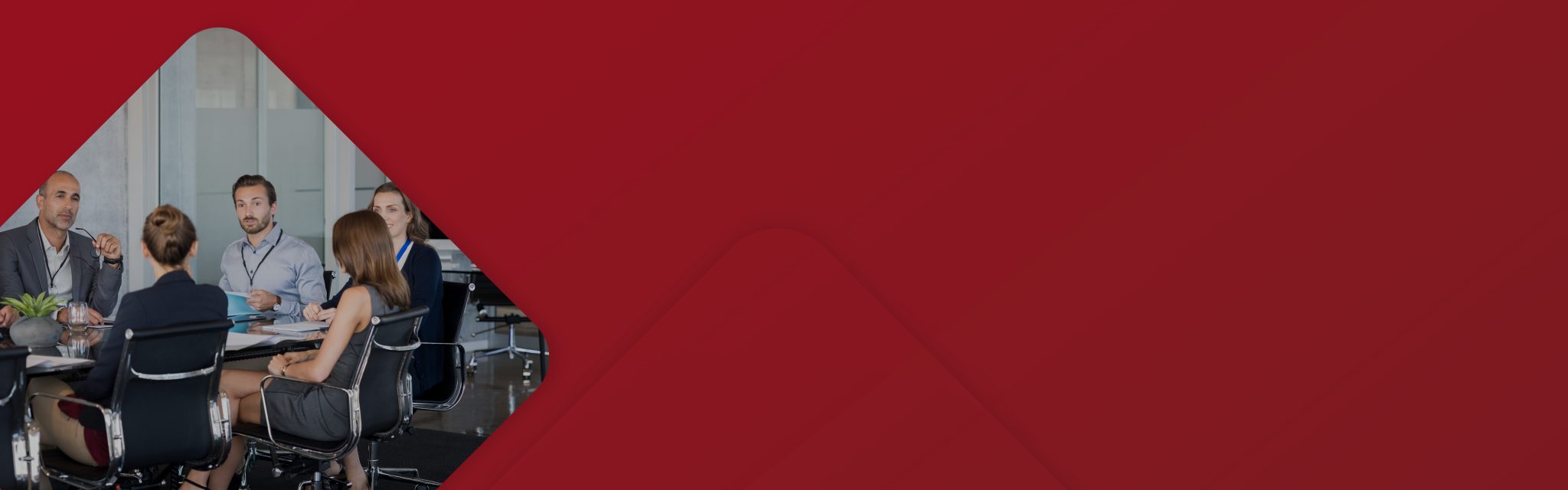 a team sat in an office newmark header